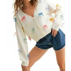 Chic Cream Cardigan with Colorful Bow Details